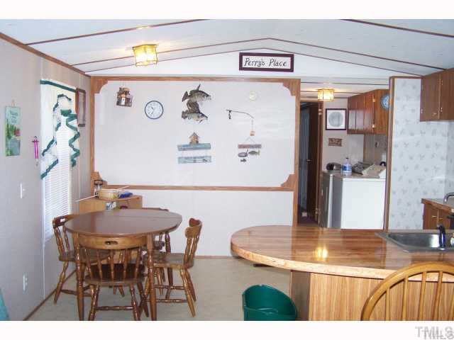 88 North Piney Grove Road Manson, NC 27553 - Photo 4 of 7 Kitchen area with eat a counter plus dining area