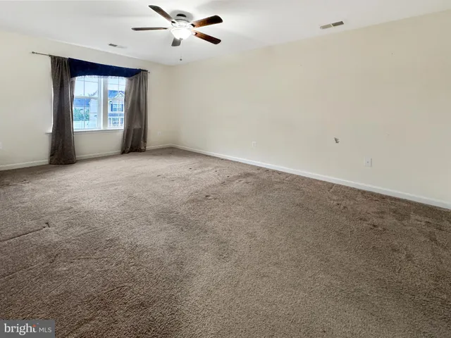 a large kitchen with a stove a sink dishwasher and a refrigerator