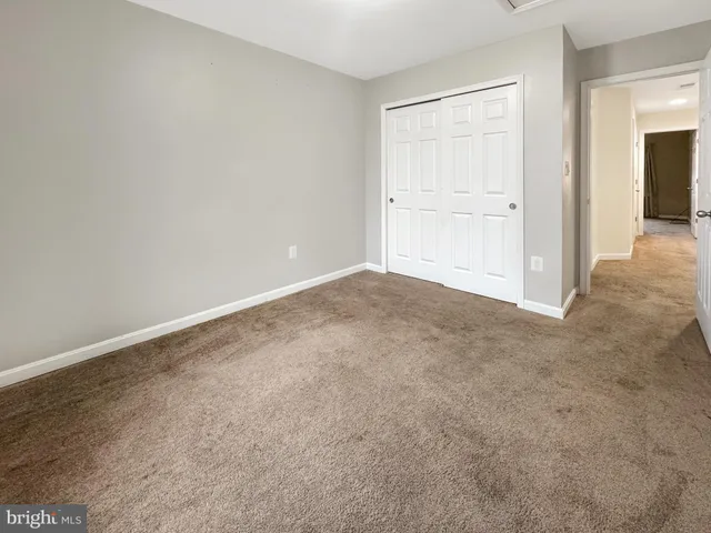 a view of a hallway with closet area