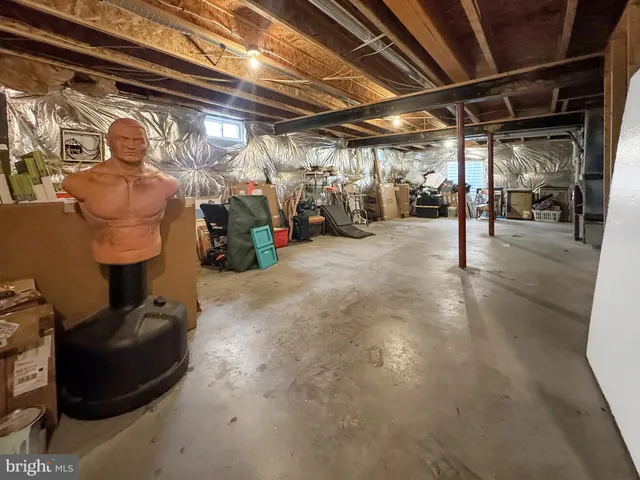 a view of the empty room with wooden floor