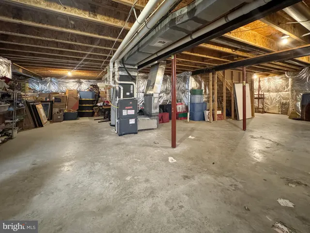 a view of a swimming pool with an outdoor seating and a yard
