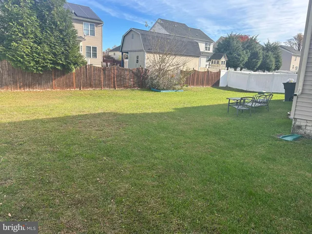 a view of a backyard of the house