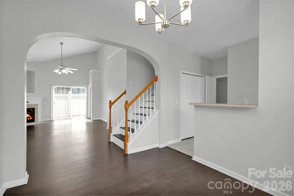 a kitchen with white cabinets and a stove top oven