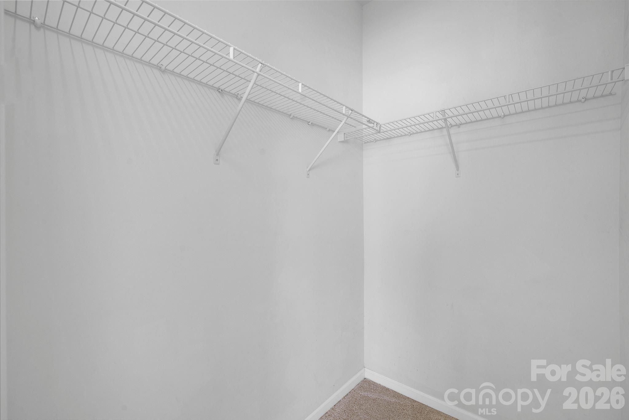 4966 Sunset Ridge Court Charlotte, NC 28269 - Photo 23 of 42 a view of a room with racks on the wall