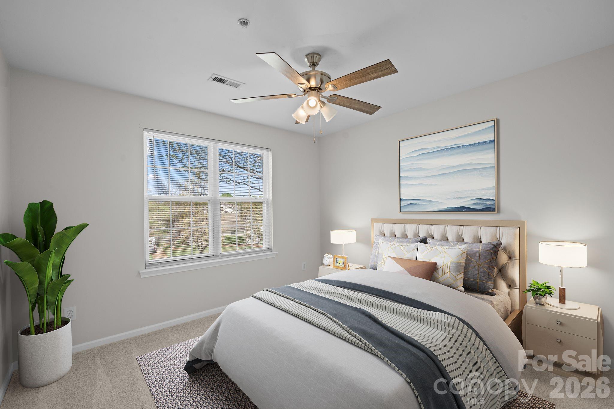 4966 Sunset Ridge Court Charlotte, NC 28269 - Photo 25 of 42 a bedroom with a large bed and a window