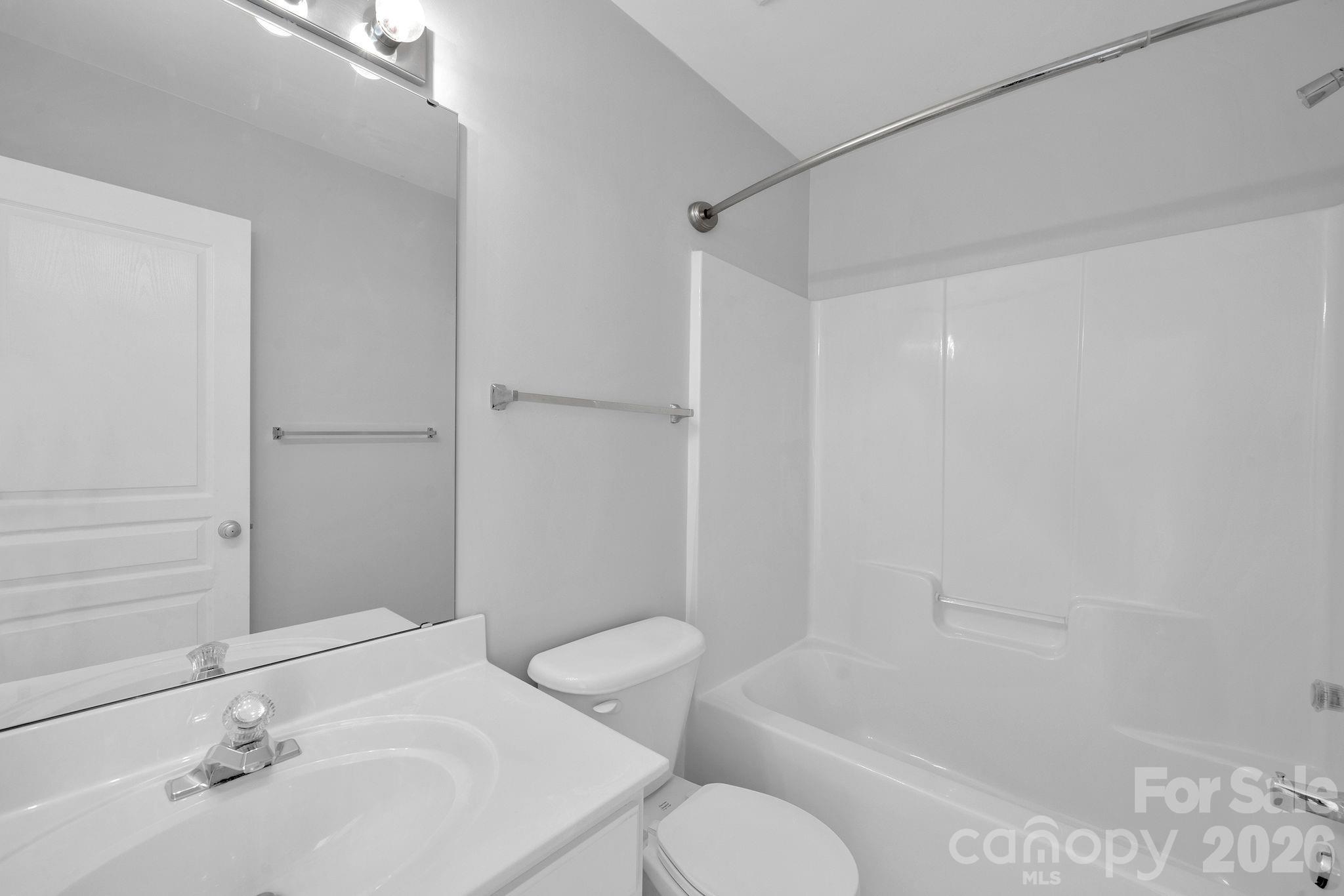 4966 Sunset Ridge Court Charlotte, NC 28269 - Photo 30 of 42 a bathroom with a sink toilet and shower