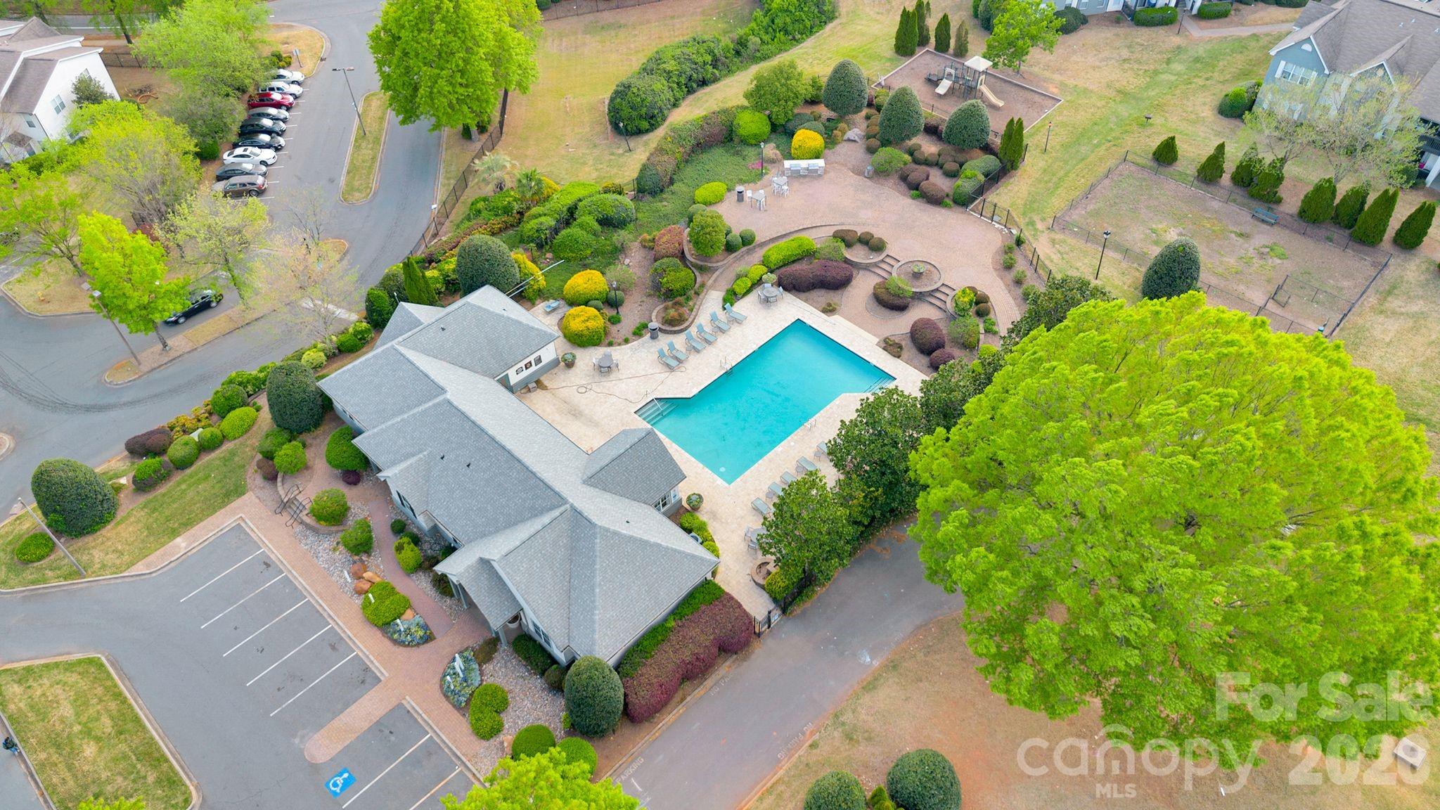4966 Sunset Ridge Court Charlotte, NC 28269 - Photo 40 of 42 an aerial view of a house with a yard and garden