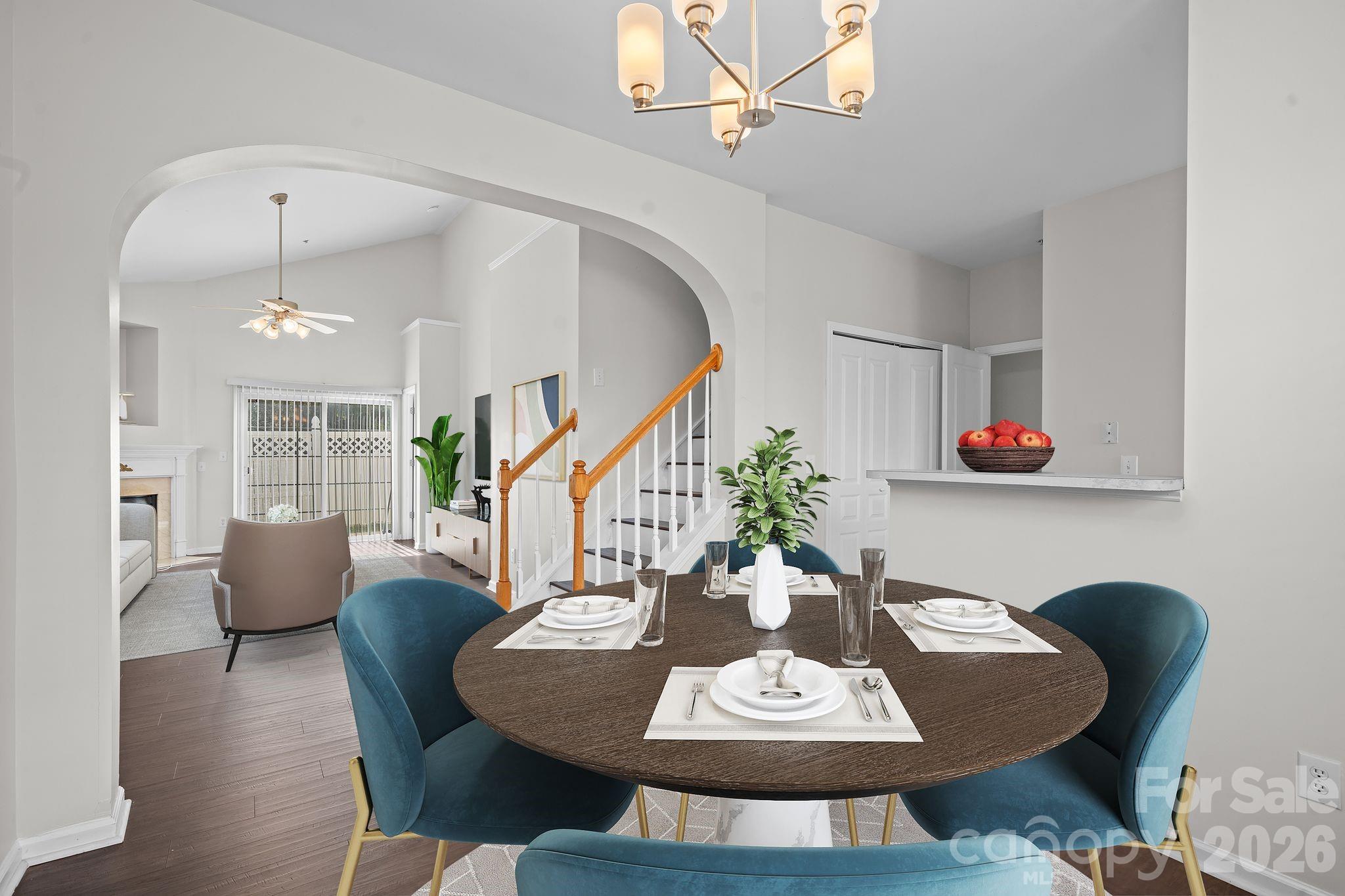 4966 Sunset Ridge Court Charlotte, NC 28269 - Photo 10 of 42 a dining room with furniture a rug and wooden floor
