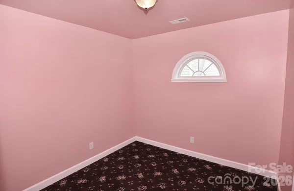 a view of a small space with racks on the wall