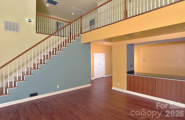 a view of an entryway with wooden floor