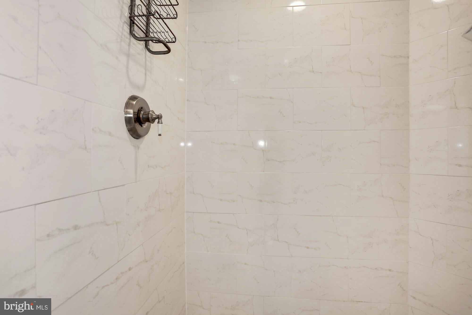 5108 Warren Place Northwest Washington, DC 20016 - Photo 17 of 32 Primary Bath with Glass-Enclosed Shower