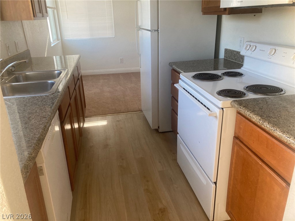 1828 North Decatur Boulevard, Unit 201 Las Vegas, NV 89108 - Photo 10 of 30 Functional kitchen with ample counter space and essential appliances, ready for your culinary creations.