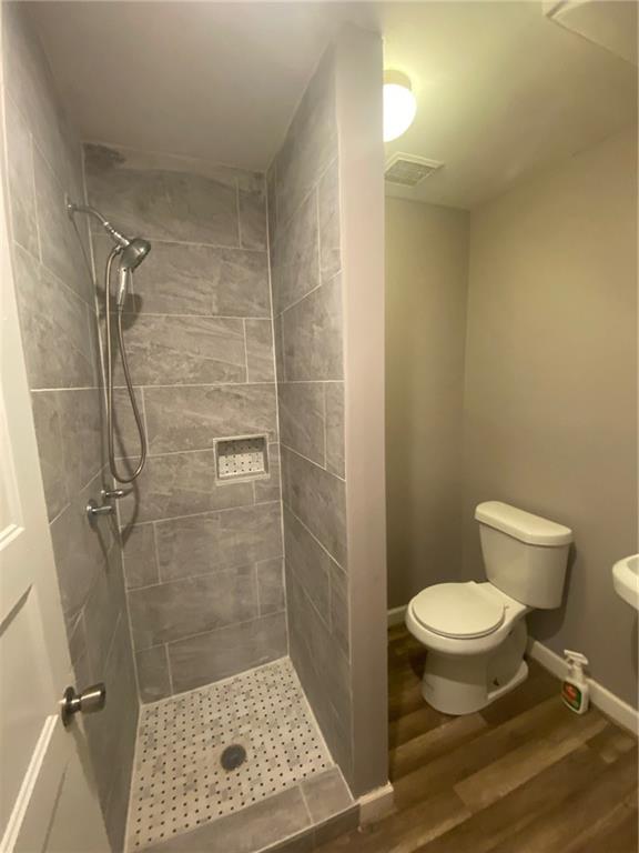 336 Simpson Terrace Northwest Atlanta, GA 30314 - Photo 12 of 15 a bathroom with a toilet and a shower