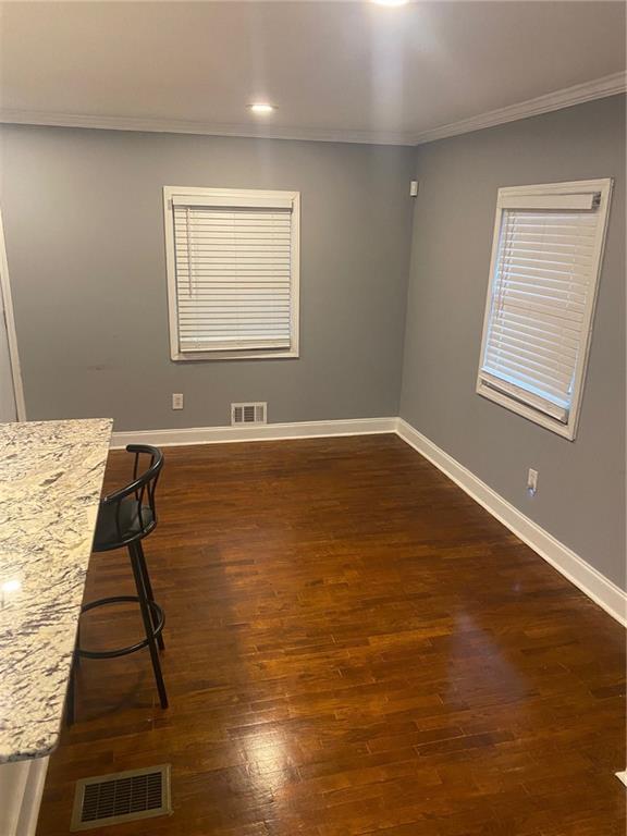 336 Simpson Terrace Northwest Atlanta, GA 30314 - Photo 4 of 15 a view of a room with wooden floor and windows