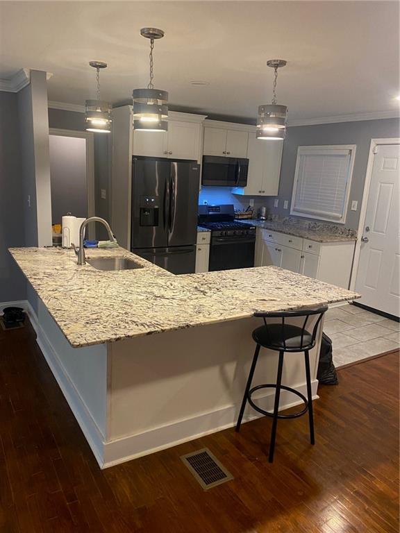 336 Simpson Terrace Northwest Atlanta, GA 30314 - Photo 5 of 15 a view of kitchen island with granite countertop living room