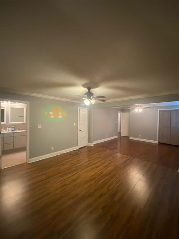 336 Simpson Terrace Northwest Atlanta, GA 30314 - Photo 10 of 15 an empty room with wooden floor door and windows