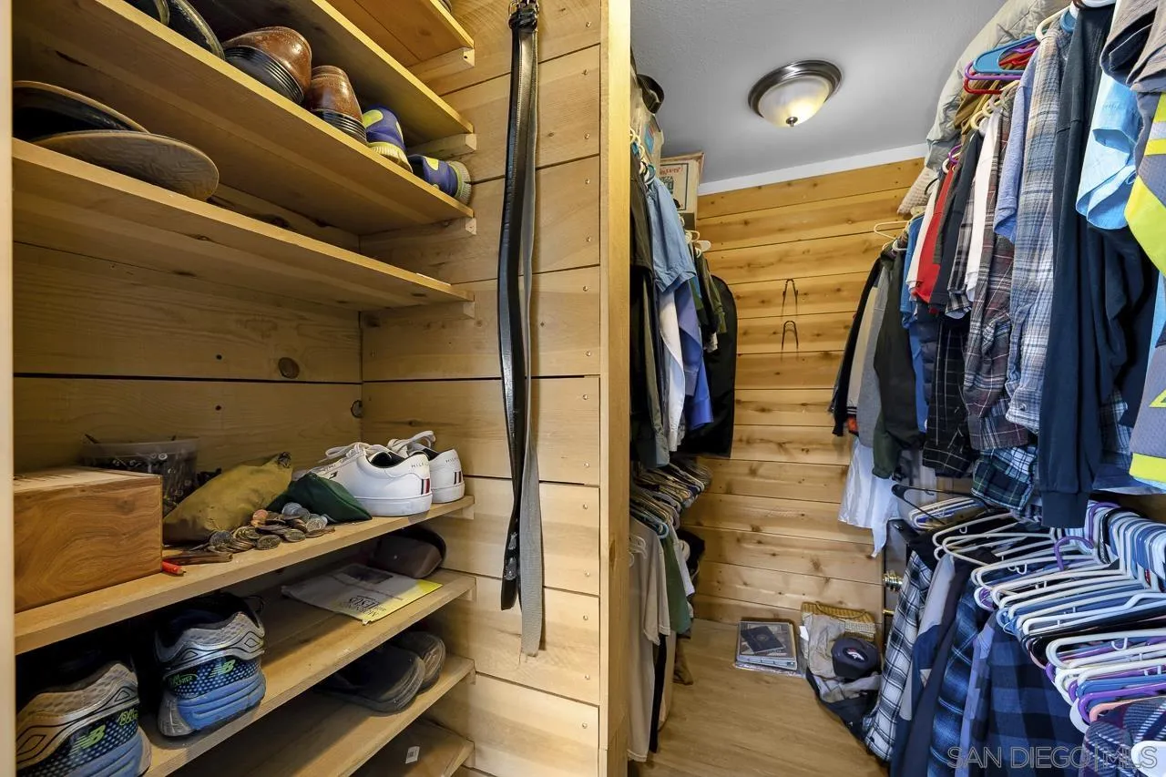 3232 Monterey Crest Drive Jamul, CA 91935 - Photo 18 of 52 a view of walk in closet with clothes and shoes