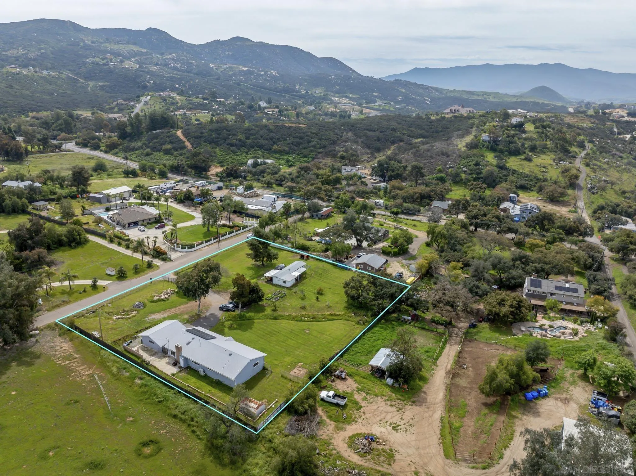 3232 Monterey Crest Drive Jamul, CA 91935 - Photo 2 of 52 an aerial view of residential house with outdoor space and mountain view