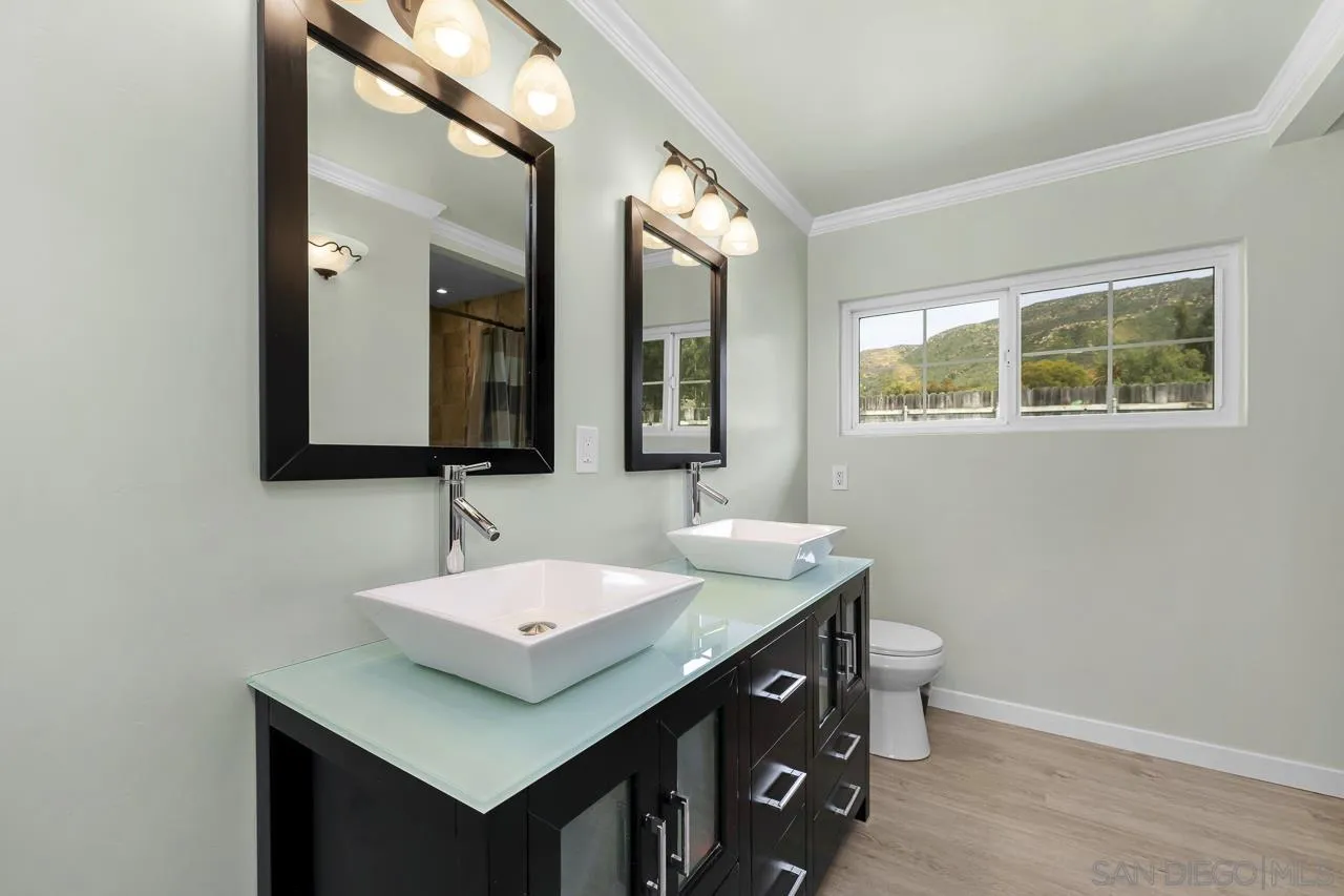 3232 Monterey Crest Drive Jamul, CA 91935 - Photo 22 of 52 a bathroom with a sink and a mirror
