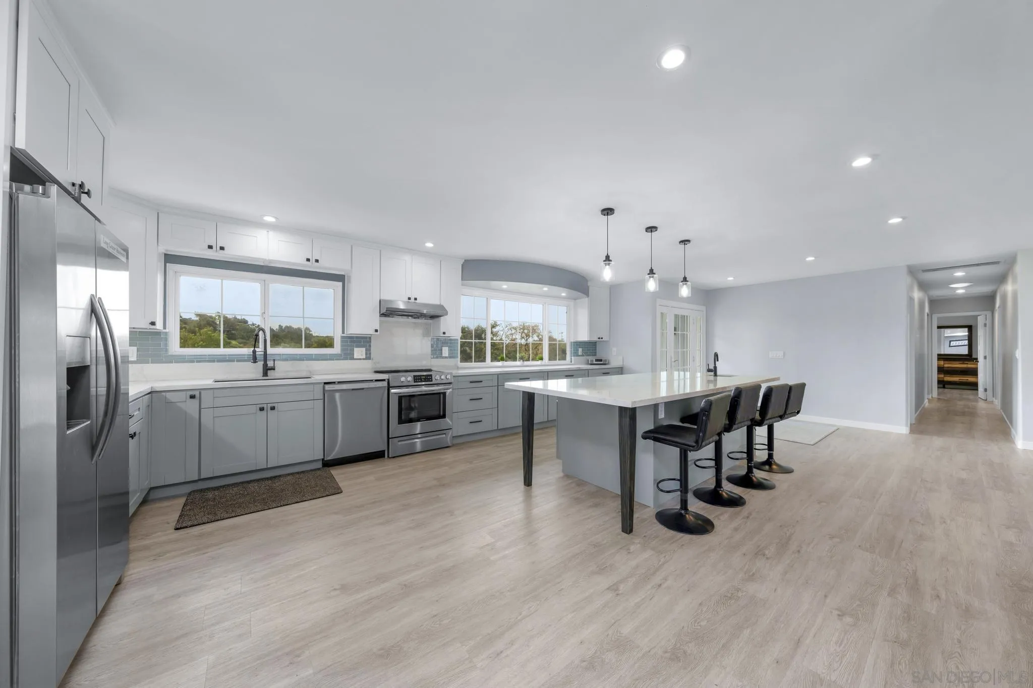 3232 Monterey Crest Drive Jamul, CA 91935 - Photo 25 of 52 a kitchen with a sink cabinets and wooden floor