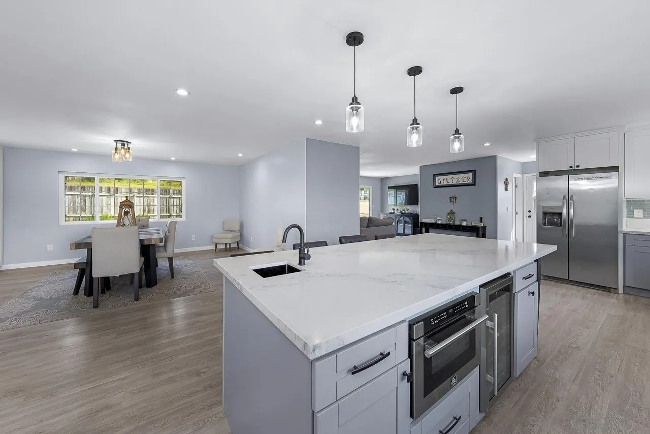 3232 Monterey Crest Drive Jamul, CA 91935 - Photo 28 of 52 a kitchen with a stove a refrigerator and a dining table