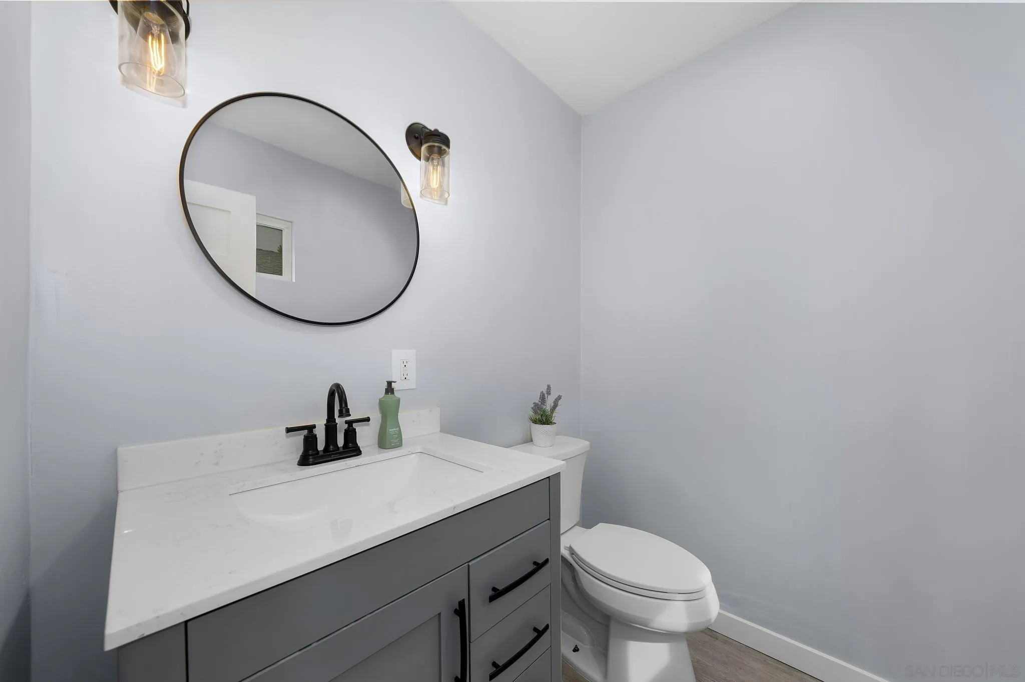 3232 Monterey Crest Drive Jamul, CA 91935 - Photo 32 of 52 a bathroom with a toilet a sink and a mirror