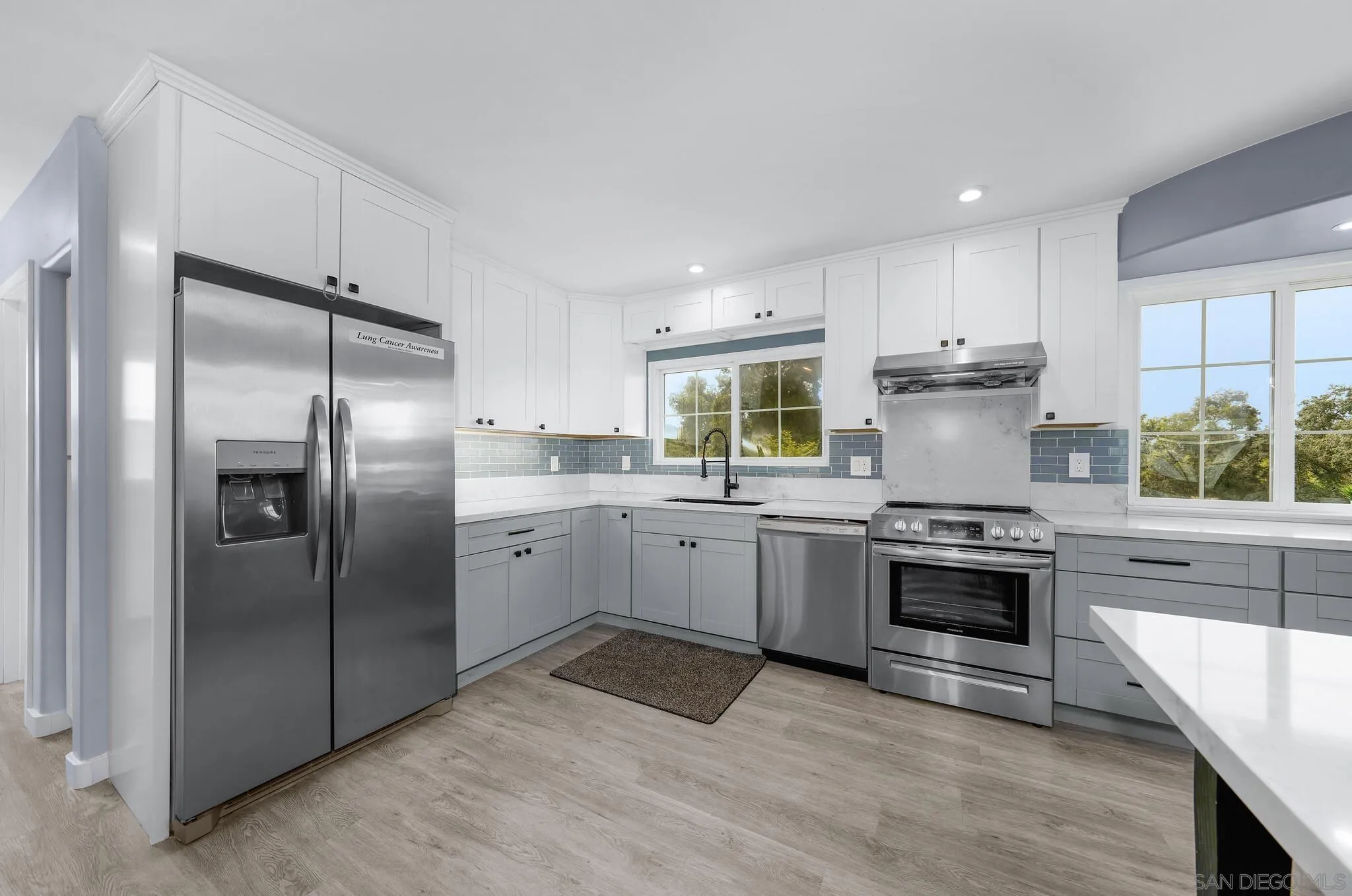 3232 Monterey Crest Drive Jamul, CA 91935 - Photo 35 of 52 a kitchen with a refrigerator stove and sink