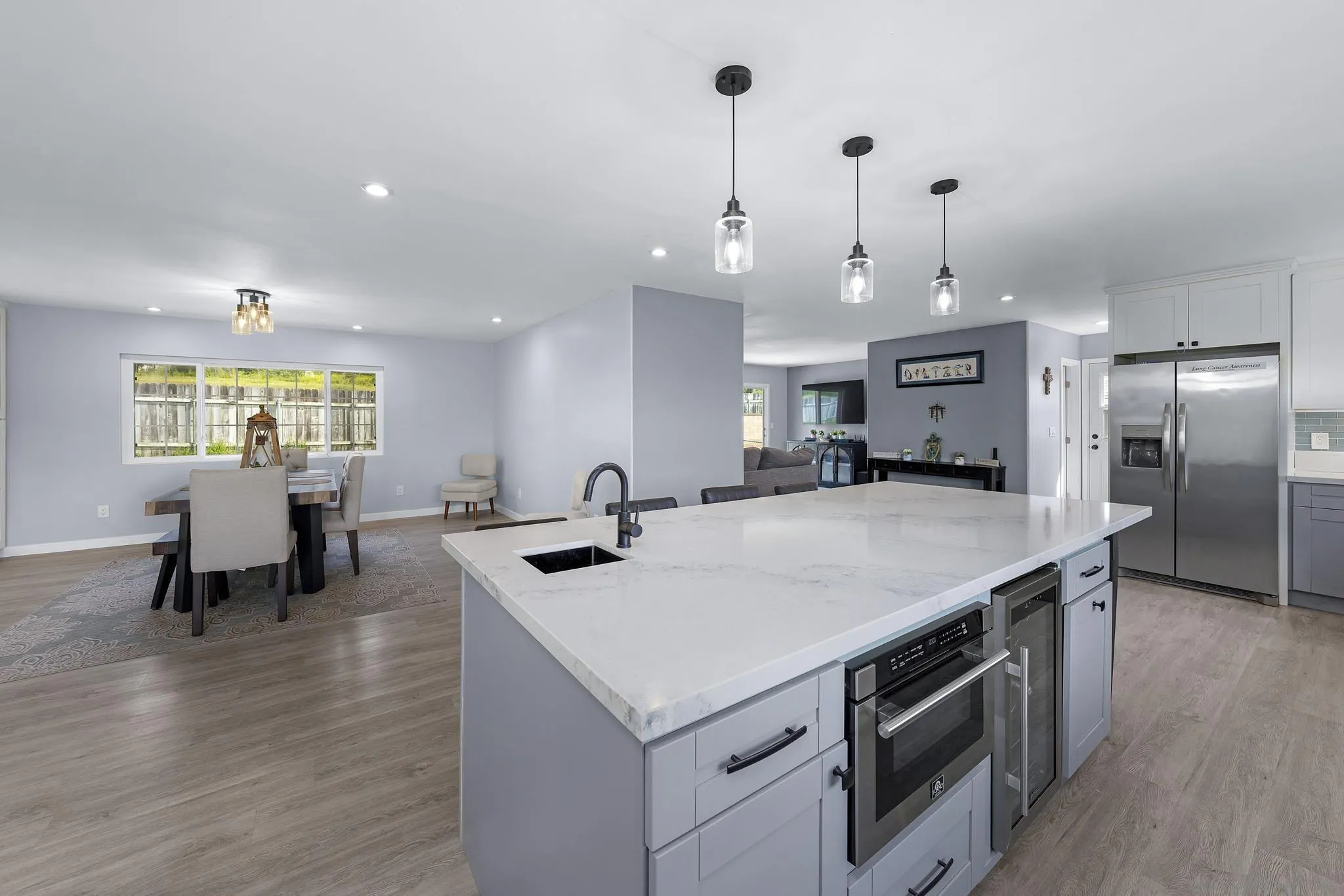 3232 Monterey Crest Drive Jamul, CA 91935 - Photo 37 of 52 a kitchen with a stove a refrigerator and a dining table