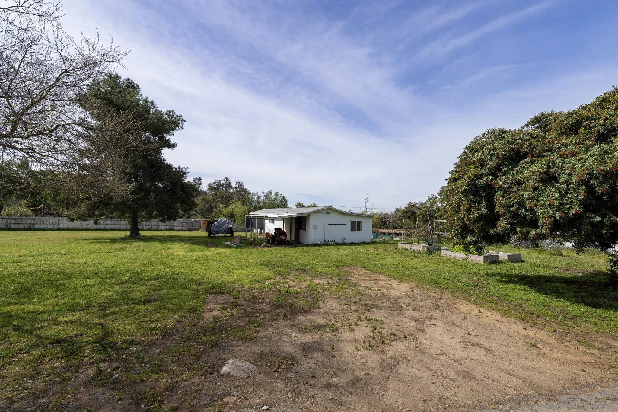 3232 Monterey Crest Drive Jamul, CA 91935 - Photo 47 of 52 a car parked in front of a house with a big yard