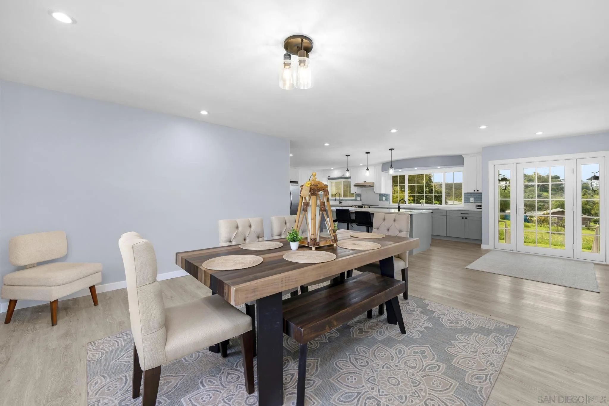 3232 Monterey Crest Drive Jamul, CA 91935 - Photo 9 of 52 a view of a dining room with furniture and wooden floor