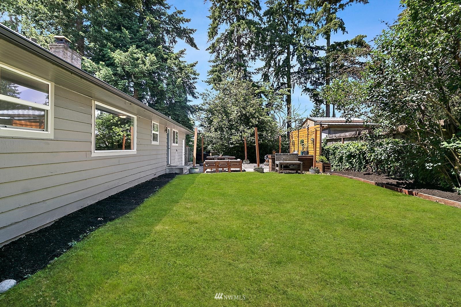 2802 South 304th Street Federal Way, WA 98003 - Photo 21 of 24 a view of a house with backyard and sitting area