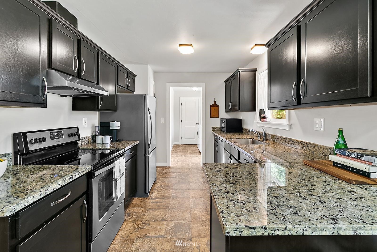 2802 South 304th Street Federal Way, WA 98003 - Photo 7 of 24 a large kitchen with stainless steel appliances granite countertop a stove refrigerator and a sink