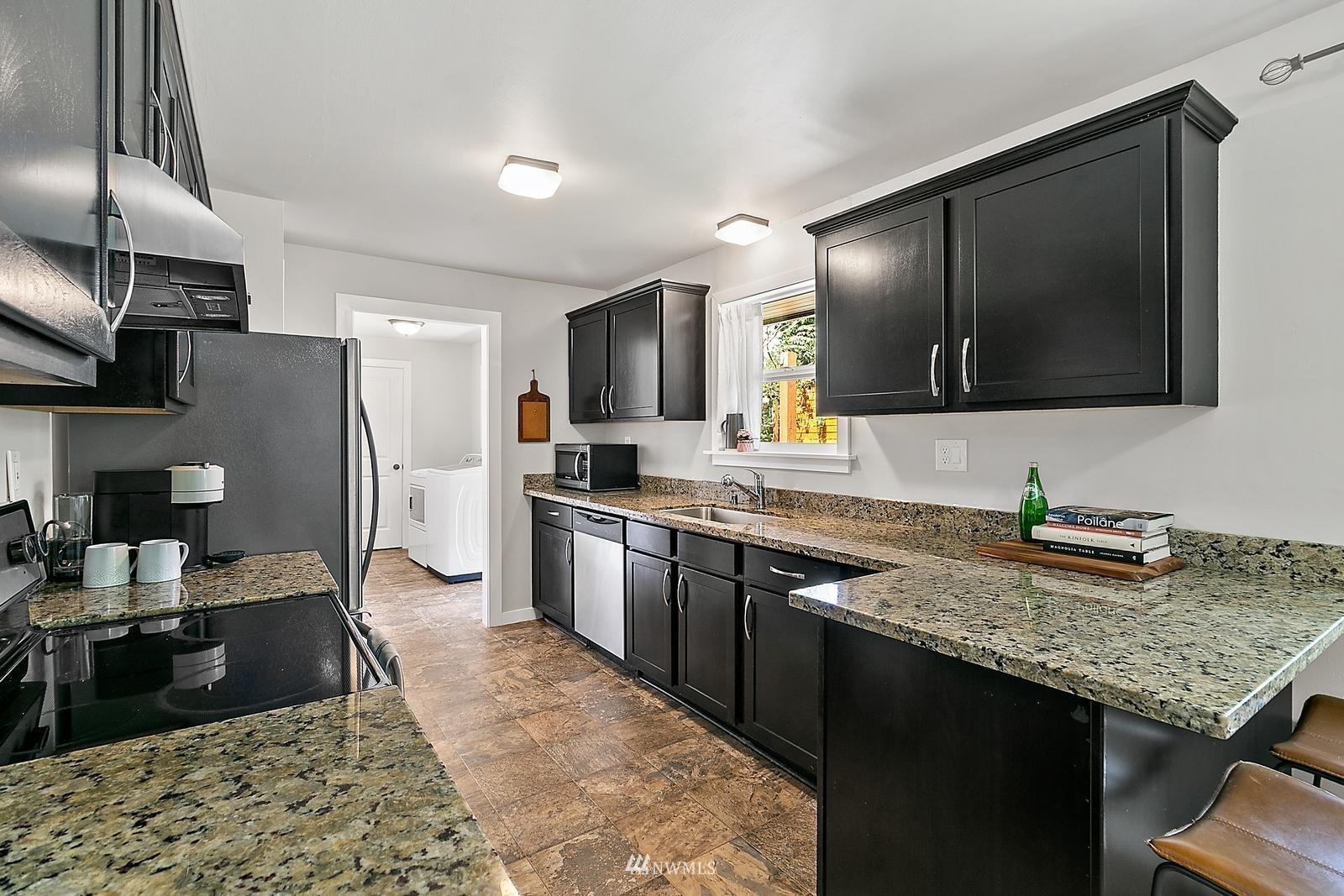 2802 South 304th Street Federal Way, WA 98003 - Photo 9 of 24 a kitchen with a refrigerator stove microwave and sink