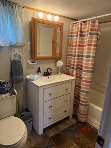 124 Hazen Road Shirley, MA 01464 - Photo 6 of 31 a bathroom with a sink a toilet and shower curtain