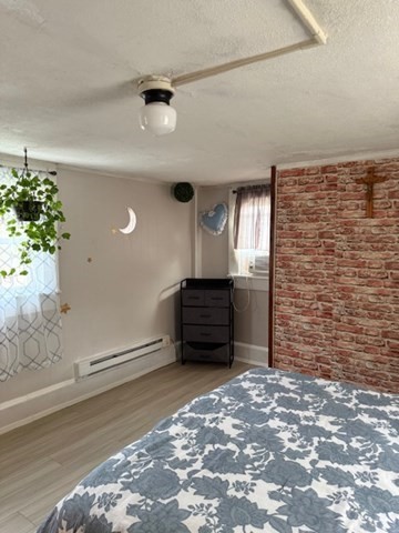 124 Hazen Road Shirley, MA 01464 - Photo 10 of 31 a view of a livingroom with an empty space and a window