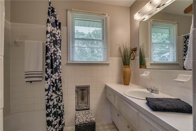 1394 Pomona Road Dickson, TN 37055 - Photo 14 of 20 a bathroom with a sink a vanity and a window