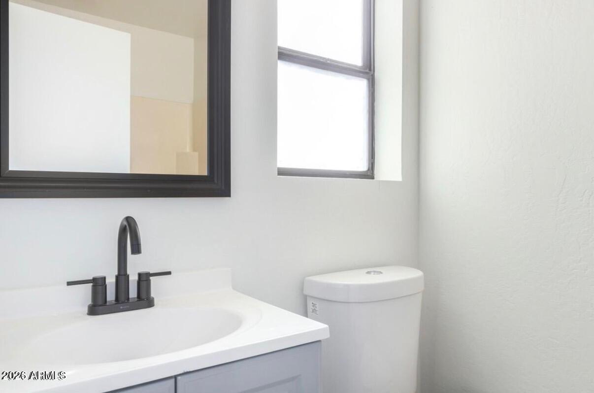 2554 West Kathleen Road Phoenix, AZ 85023 - Photo 16 of 22 a bathroom with a sink and a toilet