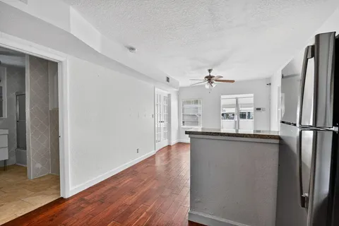 a kitchen with stainless steel appliances a refrigerator and microwave