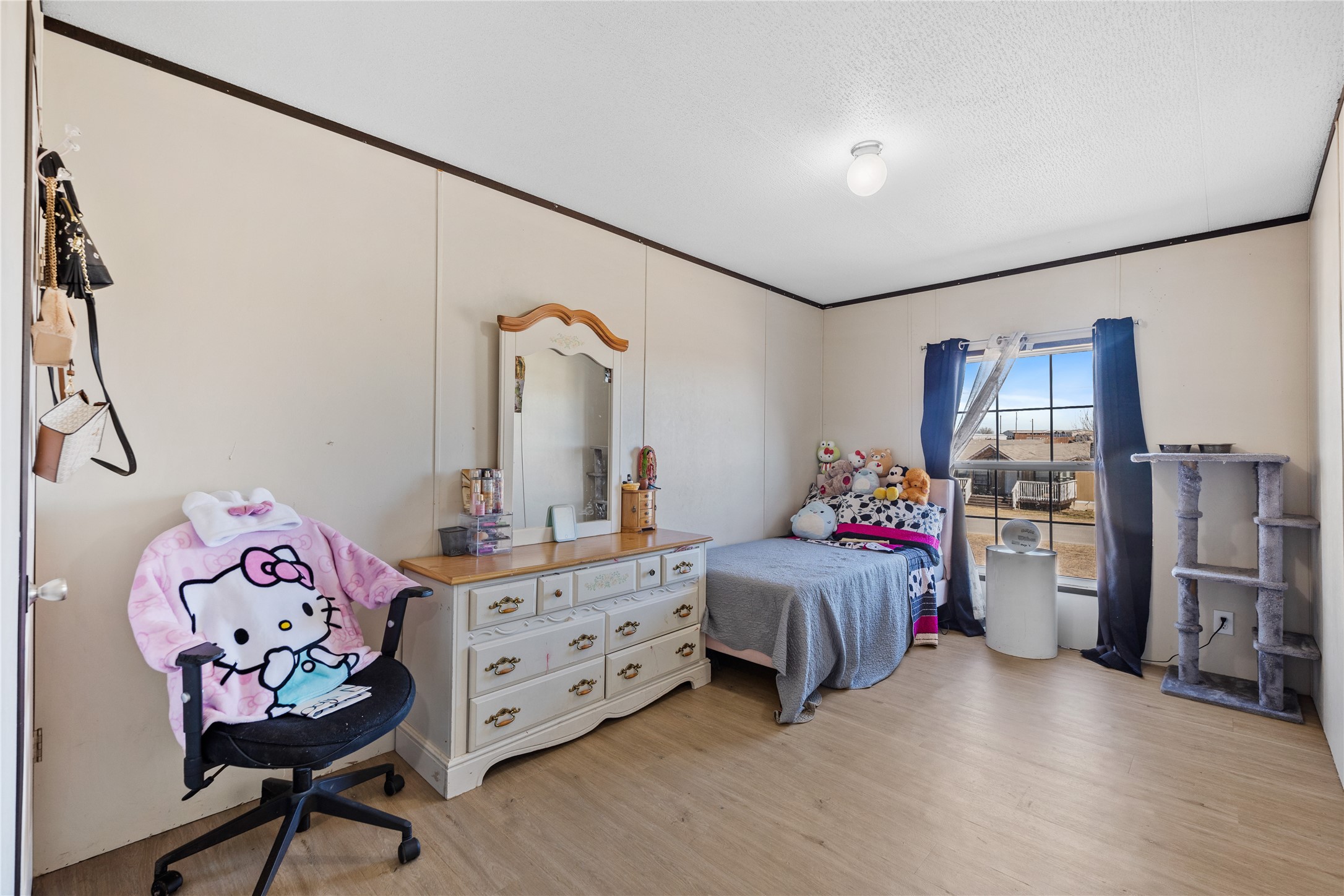 513 Duchess Pass Kyle, TX 78640 - Photo 12 of 16 a bedroom with furniture and a bed