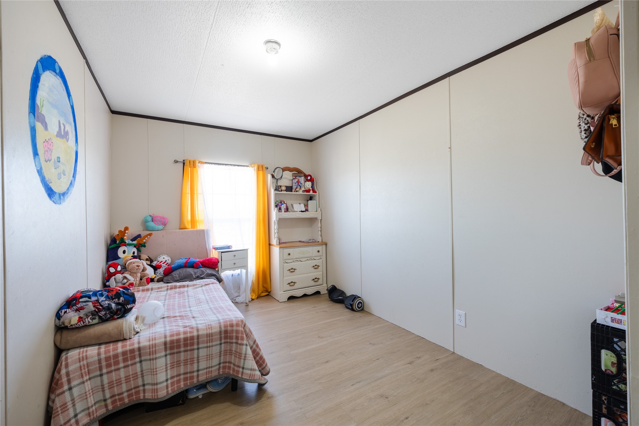 513 Duchess Pass Kyle, TX 78640 - Photo 9 of 16 a bedroom with bed and a window