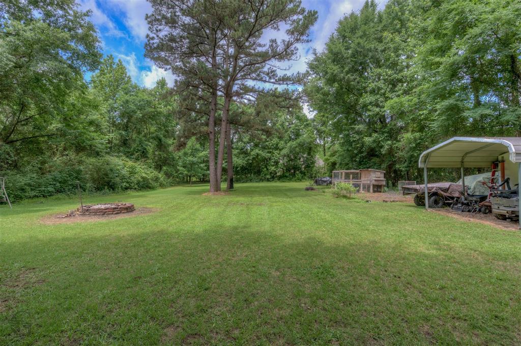 701 Chandler Road Haughton, LA 71037 - Photo 23 of 25 a view of backyard with a barn and large trees