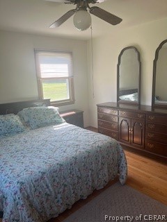 9328 Mary Ball Road Lancaster, VA 22503 - Photo 5 of 11 Bedroom with hardwood / wood-style floors and ceiling fan