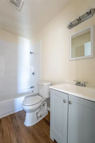 a bedroom with a bed and a desk