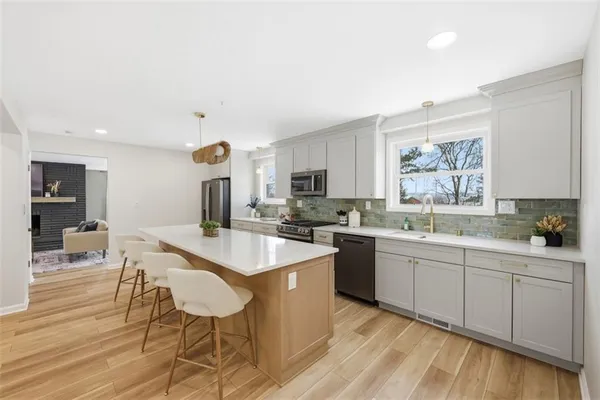 a kitchen with a sink and cabinets