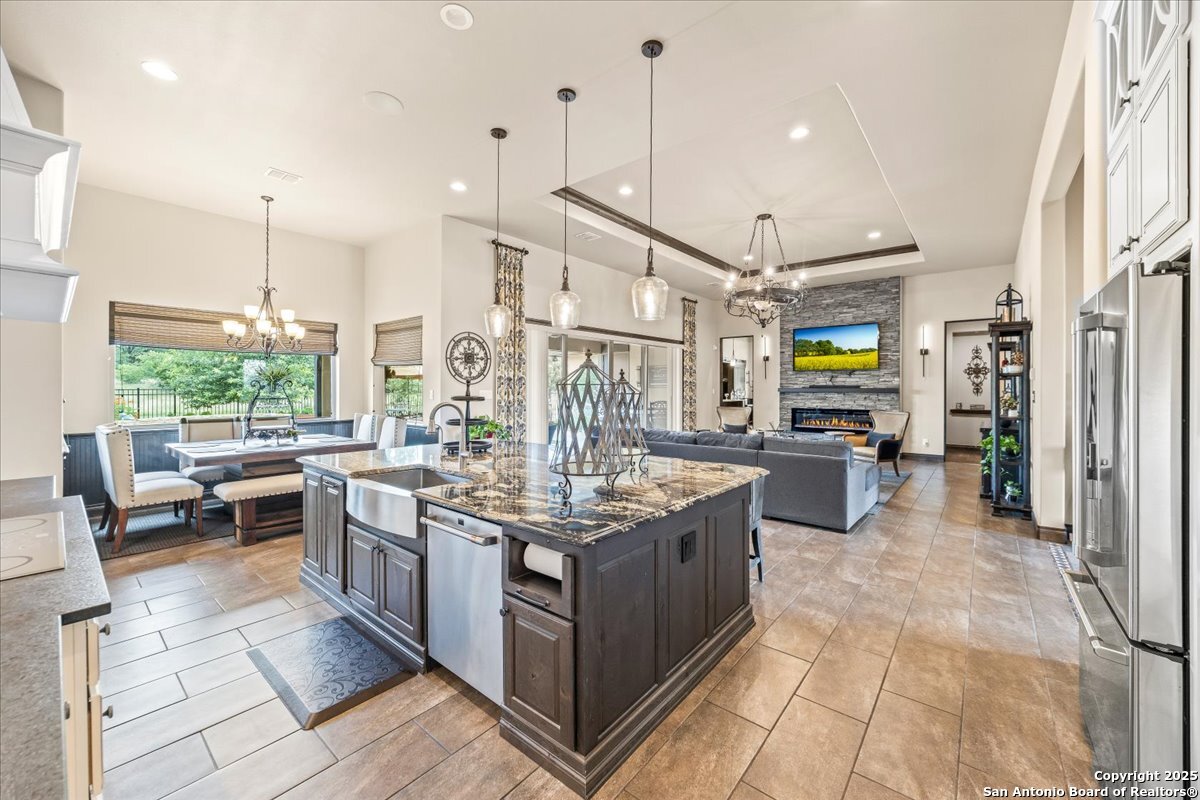 742 Pacific Spring Branch, TX 78070 - Photo 11 of 52 a kitchen with stainless steel appliances granite countertop a stove a sink and a refrigerator