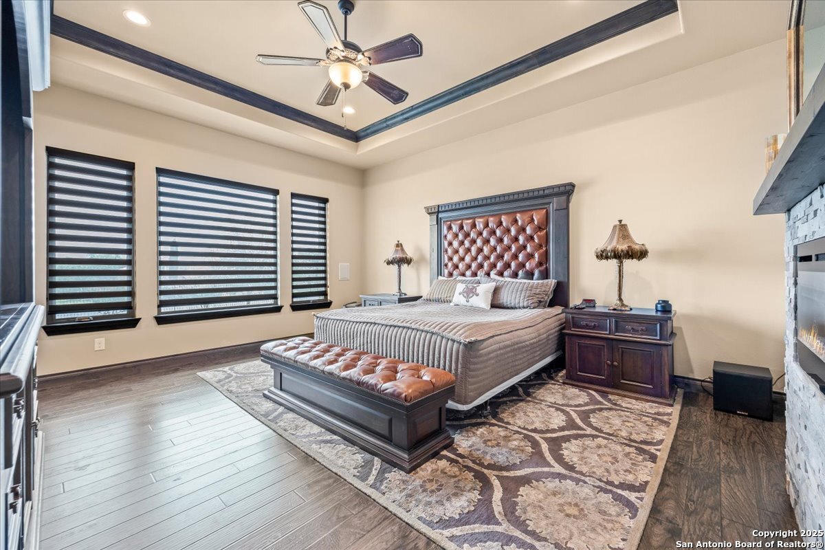 742 Pacific Spring Branch, TX 78070 - Photo 15 of 52 a spacious bedroom with a bed and a chandelier