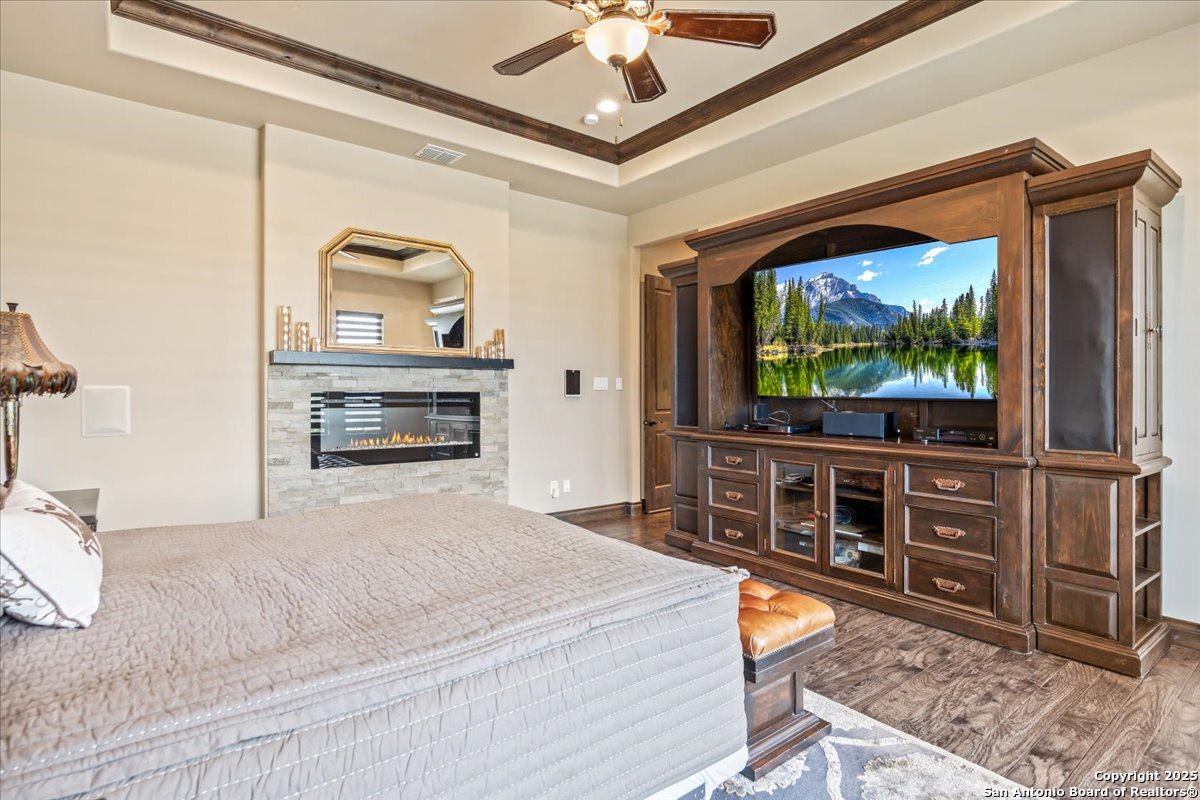 742 Pacific Spring Branch, TX 78070 - Photo 16 of 52 a bedroom with furniture and a flat screen tv