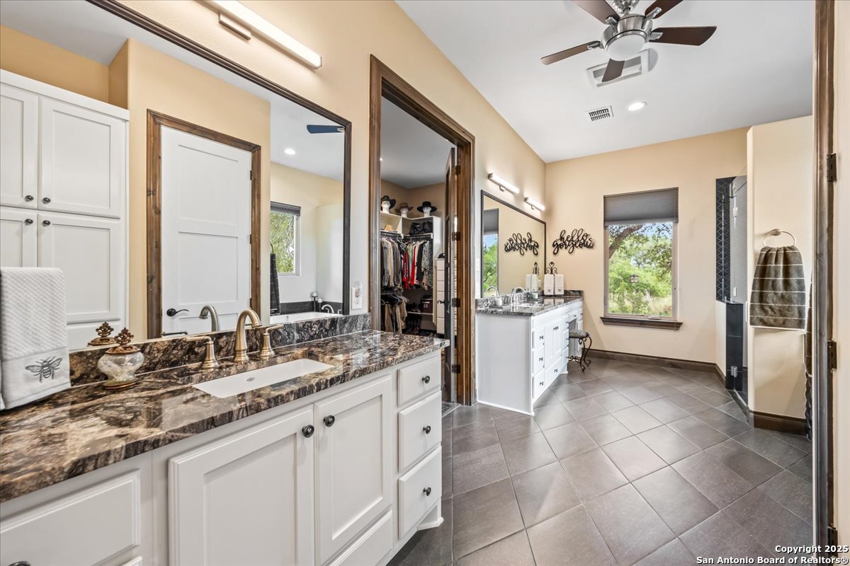 742 Pacific Spring Branch, TX 78070 - Photo 18 of 52 a bathroom with a double vanity sink and a mirror