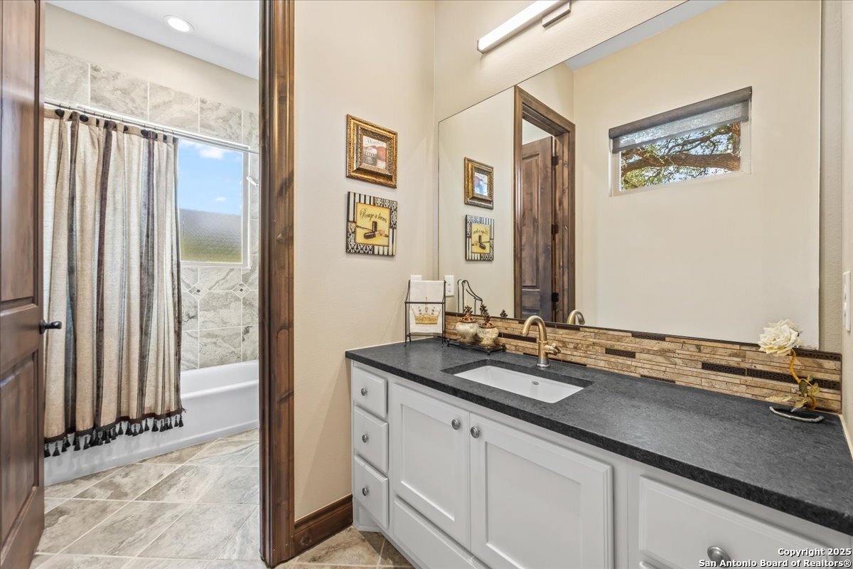 742 Pacific Spring Branch, TX 78070 - Photo 19 of 52 a bathroom with a sink and a mirror