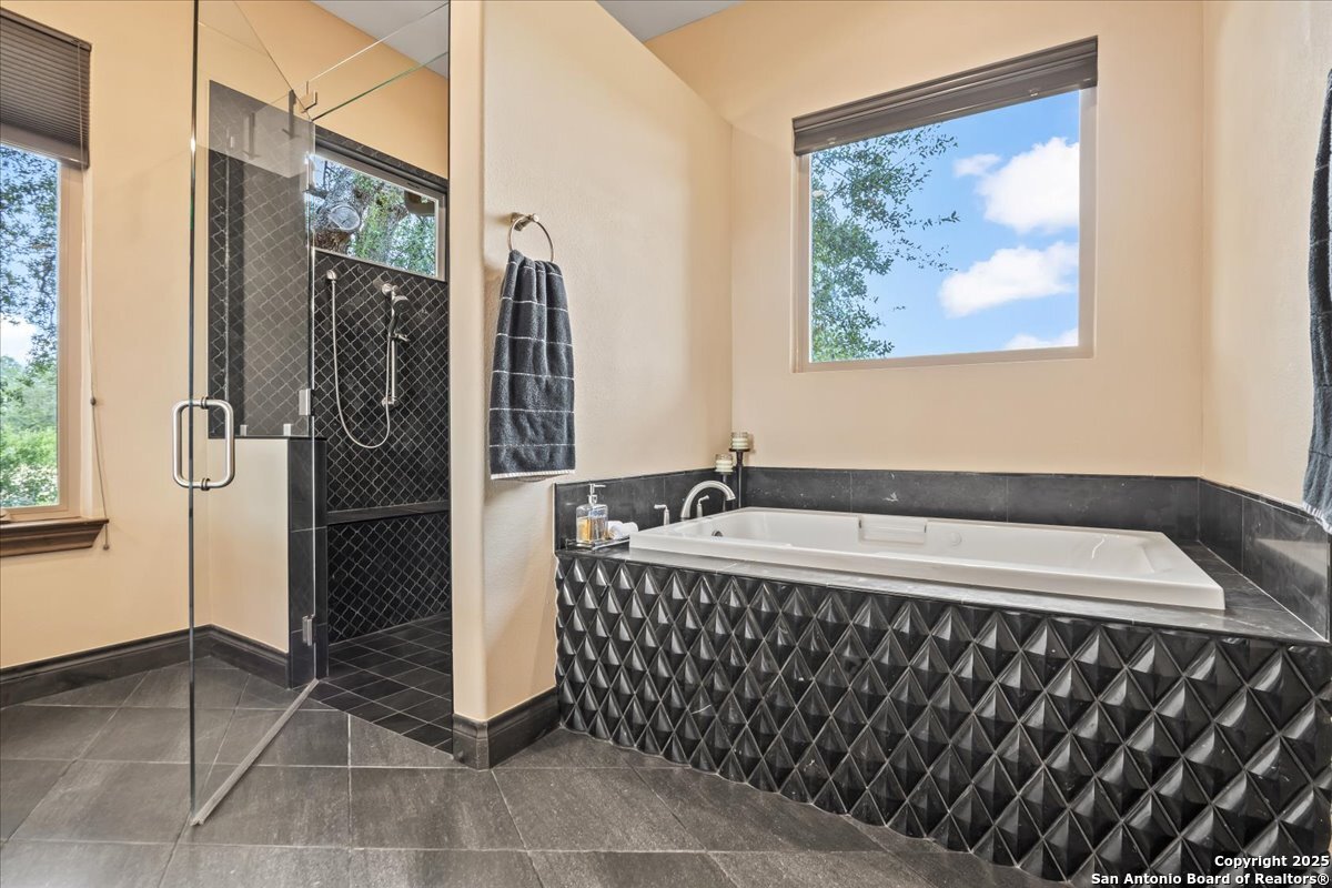 742 Pacific Spring Branch, TX 78070 - Photo 21 of 52 a bathroom with a bathtub and shower
